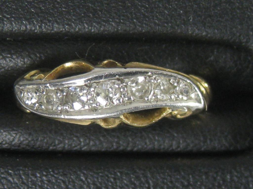 Appraisal: A seven stone Diamond Ring the circular-cut stones pave-set in