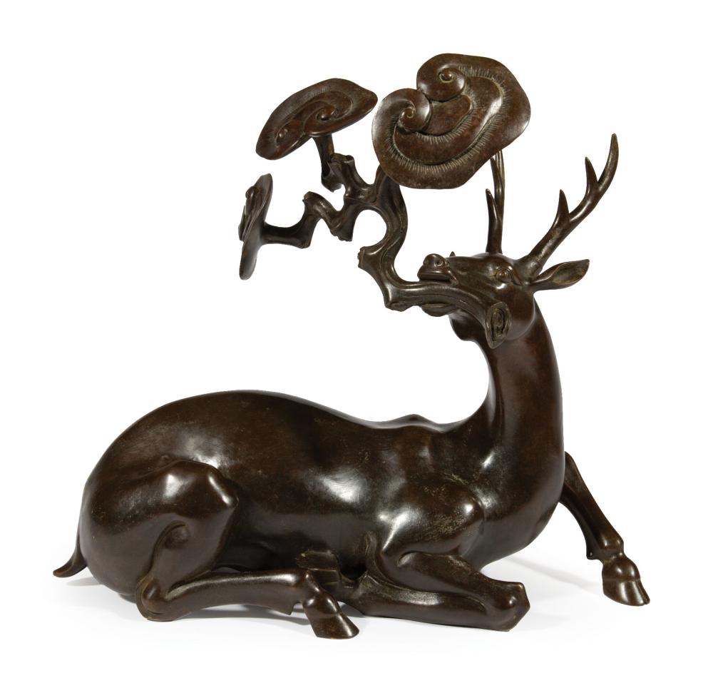 Appraisal: Chinese Patinated Bronze Figure of a Recumbent Deer modeled with