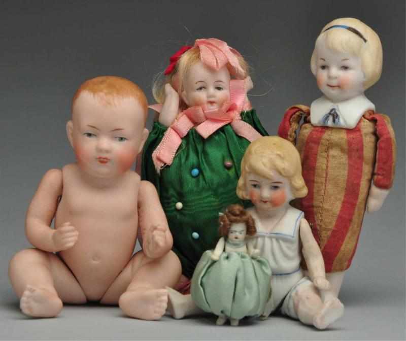 Appraisal: Lot of German All-Bisque Dolls Description Sweet character baby with