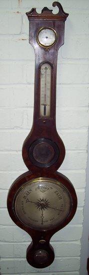 Appraisal: A Regency barometer and thermometer in a mahogany banjo shaped