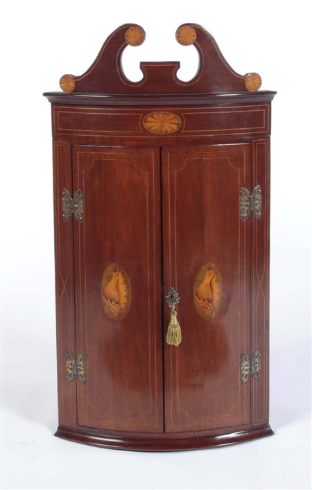 Appraisal: A small George III style mahogany and inlaid corner cupboard