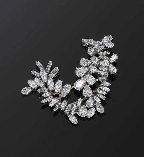 Appraisal: DIAMOND BROOCH ca Platinum Very elegant clip-brooch in a stylized