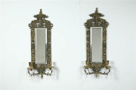 Appraisal: PAIR OF MIRRORED SCONCES Twentieth century brass Elaborate sconces with