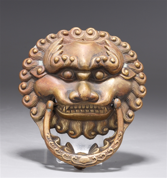 Appraisal: Chinese bronze door knocker in the form of a lion