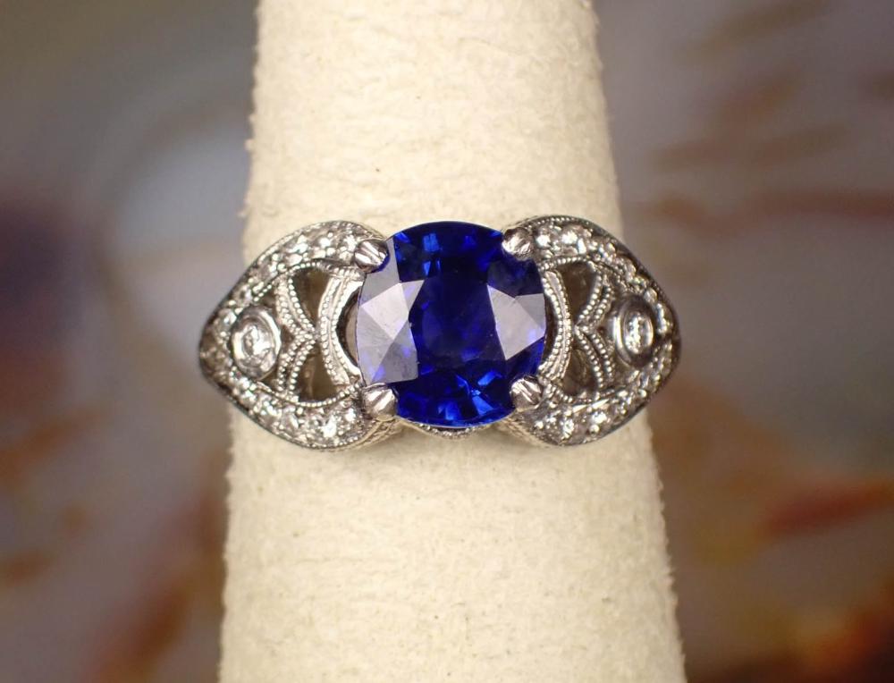 Appraisal: ANTIQUE SAPPHIRE DIAMOND AND PLATINUM RING The hand engraved filigree