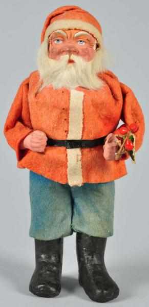 Appraisal: Wood Cutter Father Christmas Candy Container Description Tomato soup coat