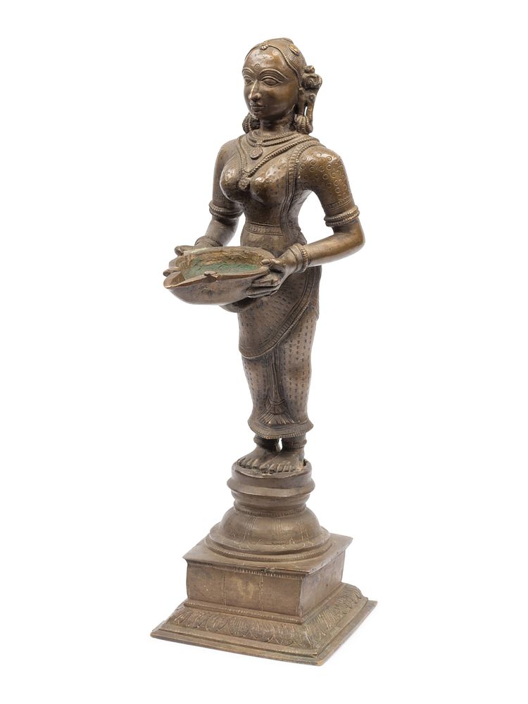 Appraisal: An Indian Patinated Metal Figure of a Standing Deity An