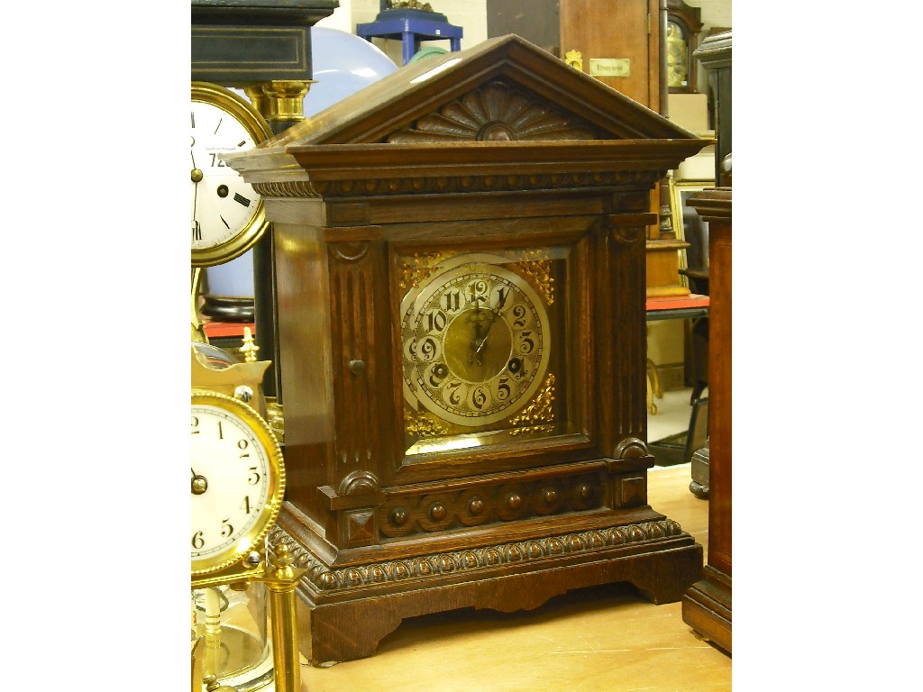 Appraisal: German oak two train mantel clock the Junghans movement striking