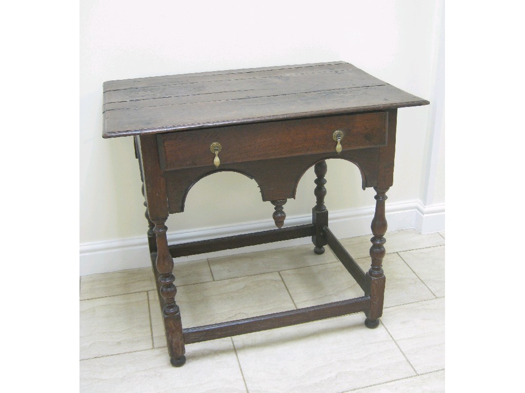 Appraisal: An th Century oak Lowboy fitted single drawer above shaped