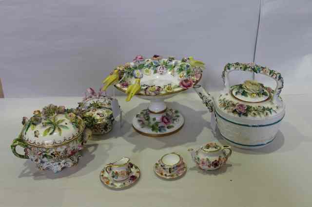 Appraisal: A MINIATURE COALPORT PORCELAIN TEASET and four pieces of cabinet