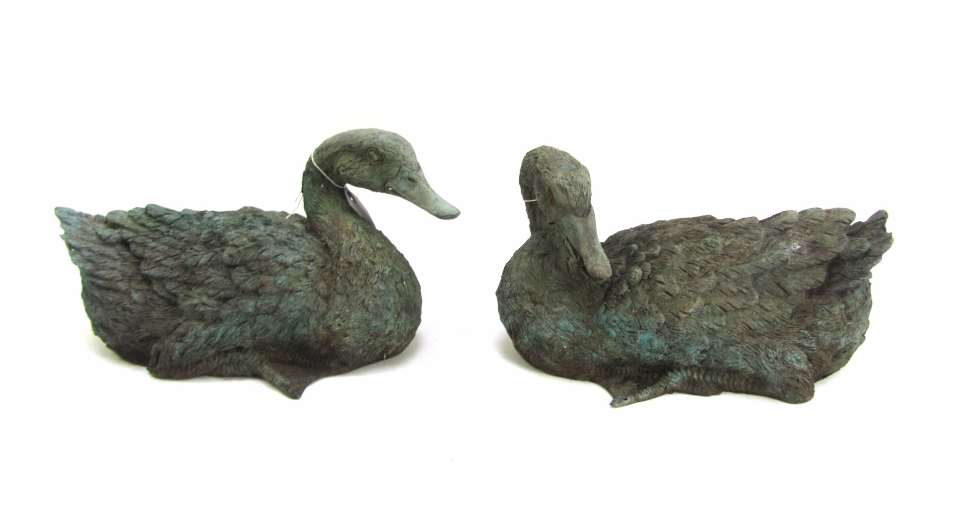 Appraisal: A pair of late th century verdigris patinated metal ducks