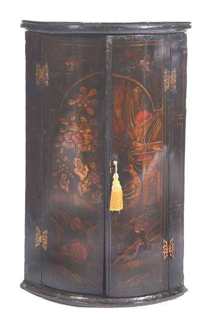 Appraisal: AN TH CENTURY BLACK LACQUERED BOWFRONTED CORNER CABINET the interior