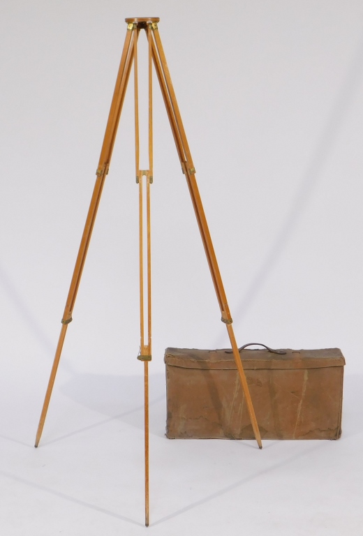 Appraisal: FOLDING WOODEN TRIPODS Folding wooden tripod with canvas covered carrying