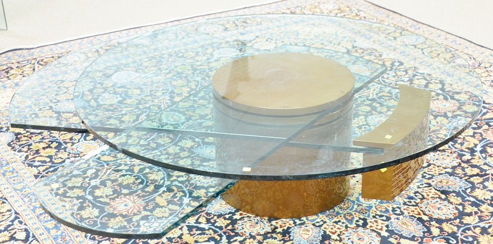 Appraisal: Dakota Jackson self-winding coffee table has three moving glass components