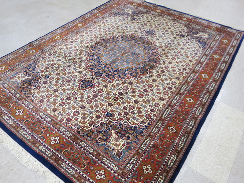 Appraisal: HAND KNOTTED ORIENTAL CARPET Indo-Persian central medallion and overall Herati