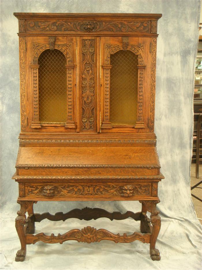 Appraisal: Two piece carved oak secretary desk with foliate carved decoration