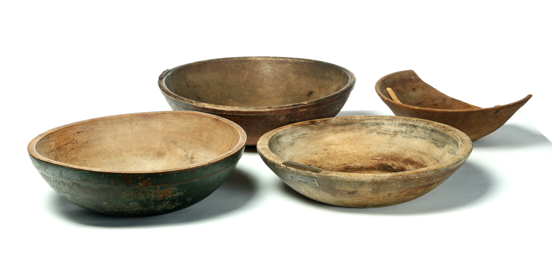 Appraisal: FOUR AMERICAN TREENWARE BOWLS Second half- th century Original salmon