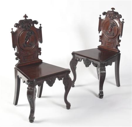 Appraisal: A pair of Victorian baronial oak carved hall chairs each