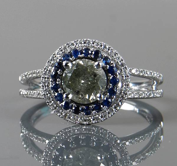 Appraisal: A diamond sapphire and k white gold ring central diamond