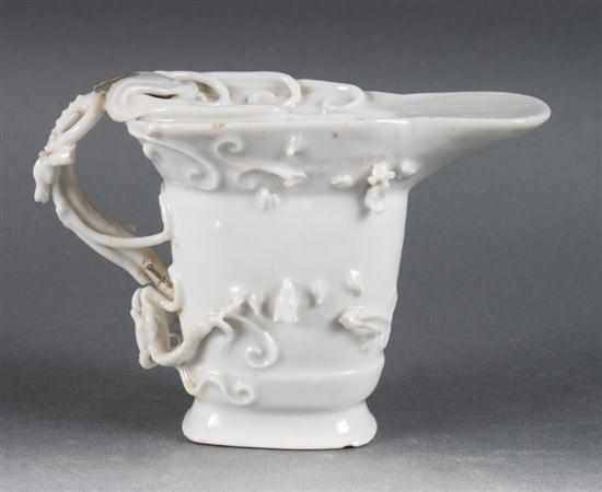 Appraisal: Chinese blanc de chine porcelain libation cup late th century