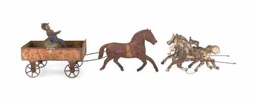 Appraisal: Painted tin horse drawn wagon th c with a driver