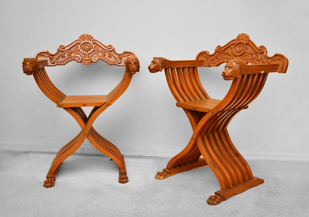 Appraisal: PAIR LION HEAD SAVONAROLA FOLDING CHAIRS Carved removable back arms