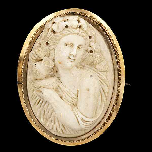 Appraisal: Antique Brooch A K yellow gold bezel set lady carved