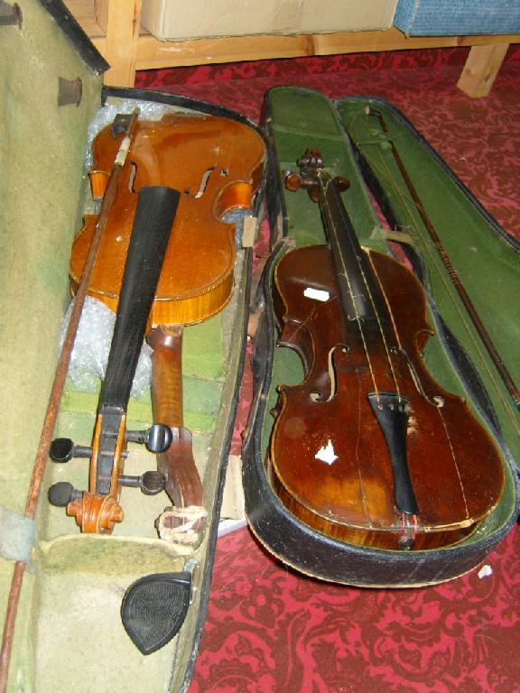 Appraisal: Two cased violins and bows