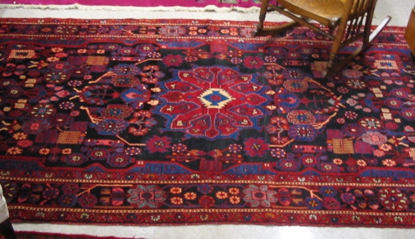 Appraisal: PERSIAN ENTRY CARPET geometric central medallion and surrounding stylized floral