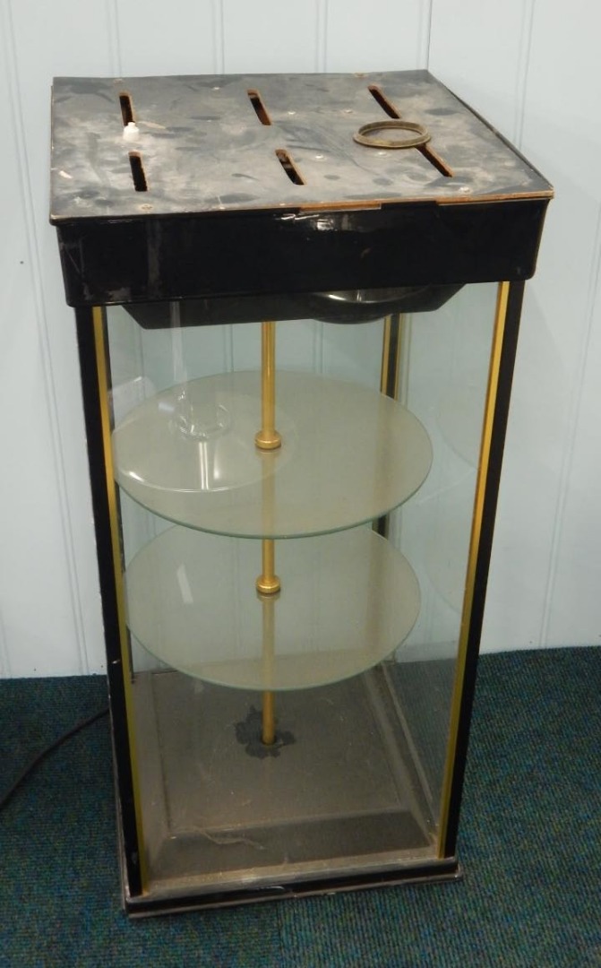 Appraisal: An electric revolving shop display cabinet with two circular tiers