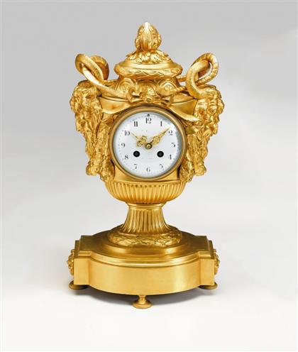 Appraisal: Louis XVI style gilt-bronze mantel clock The enameled dial with