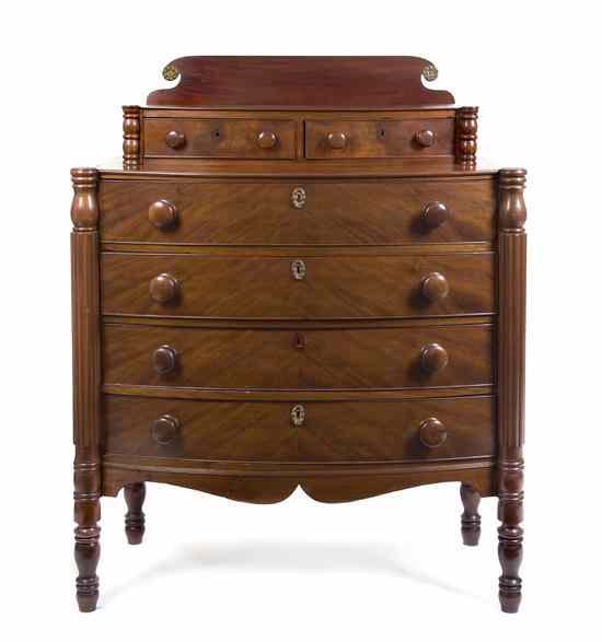 Appraisal: An American Classical Mahogany Chest of Drawers having a backsplash