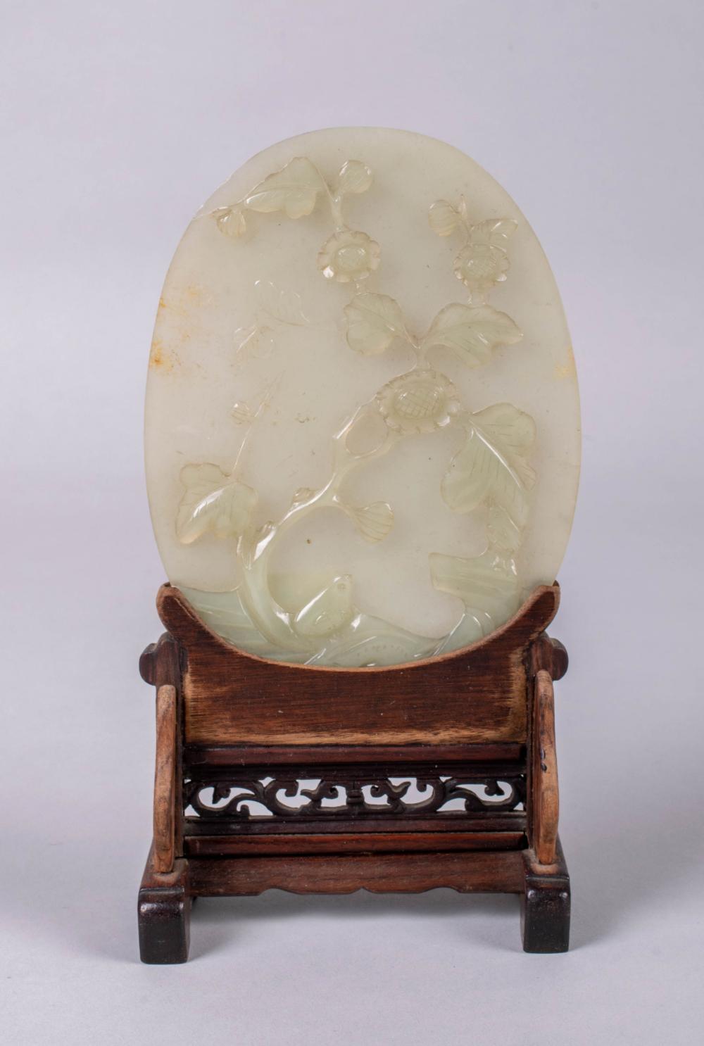 Appraisal: CHINESE WHITISH-GREEN JADE CARVED OVAL PANEL the oval panel carved