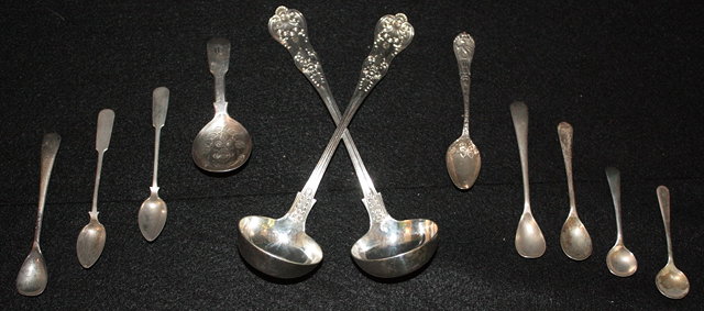 Appraisal: A GEORGIAN SILVER CADDY SPOON with chased decoration a small