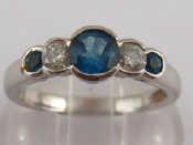 Appraisal: A Rhodium plated yellow metal tests carat gold blue topaz