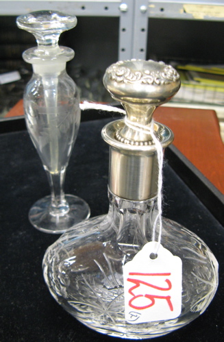 Appraisal: TWO CUT CRYSTAL CLEAR PERFUME BOTTLES One is an engraved