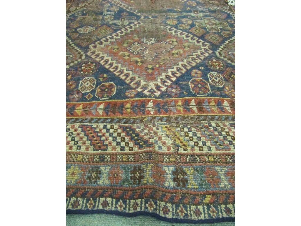 Appraisal: Thee Eastern floor rugs on multi coloured grounds