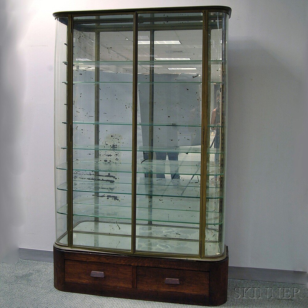 Appraisal: Brass and Glass Two-piece Display Cabinet the D-shaped brass frame