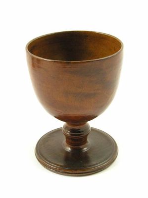 Appraisal: A turned fruitwood goblet late th early th century with