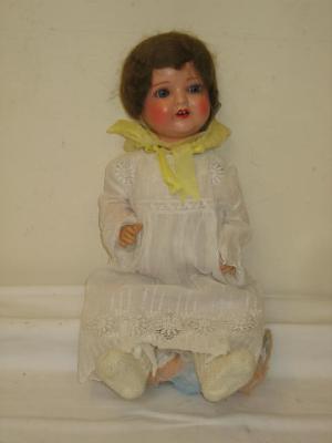 Appraisal: An Armand Marseille bisque head girl doll with blue sleeping