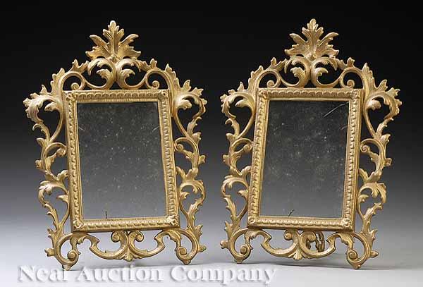 Appraisal: A Pair of Gilt Cast Iron Easel Back Picture Frames