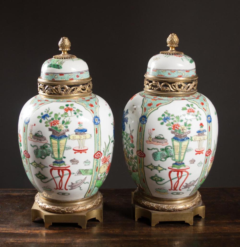 Appraisal: PAIR OF GILT BRONZE MOUNTED CHINESE PORCELAIN LIDDED JARS the