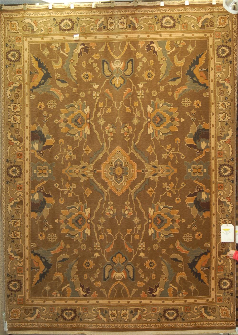 Appraisal: KARASTAN ORIENTAL MACHINE MADE WOOL RUG having a large scale