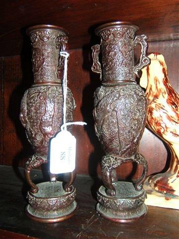 Appraisal: A pair of Oriental bronze vases of baluster form and