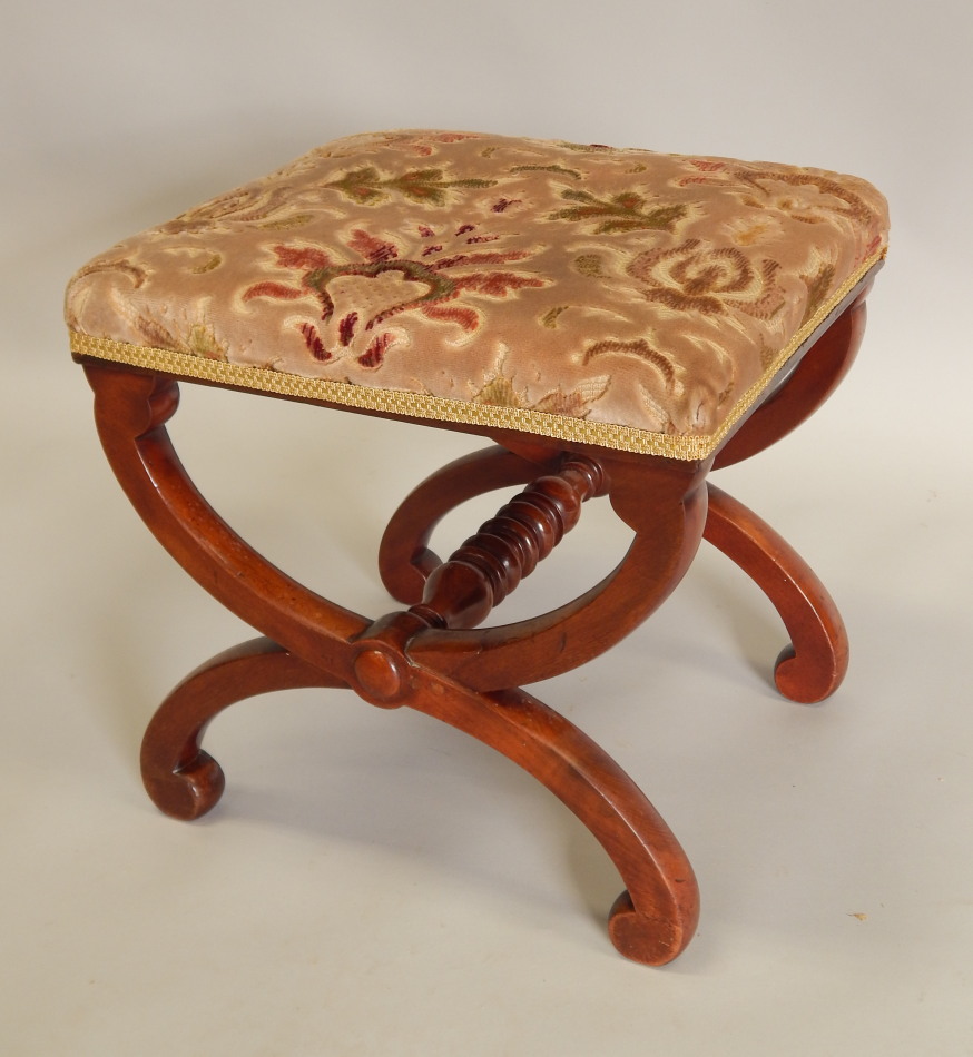 Appraisal: A Victorian mahogany stool with a padded seat on x