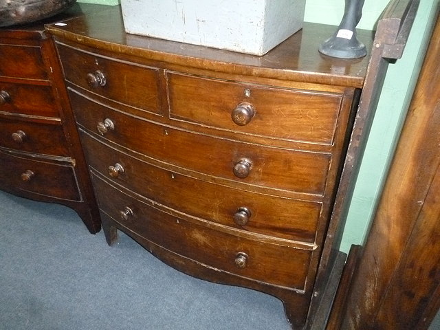 Appraisal: A VICTORIAN MAHOGANY BOW FRONTED CHEST of two short and