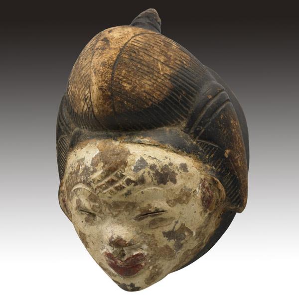 Appraisal: MINIATURE PUNU MASK GABON Classic female face with incised coiffure