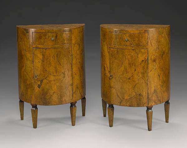 Appraisal: A pair of figured fruitwood demilune commodes circa Each with