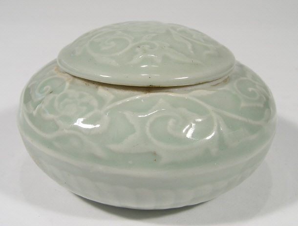 Appraisal: Oriental Celedon glazed porcelain bun shaped box and cover relief