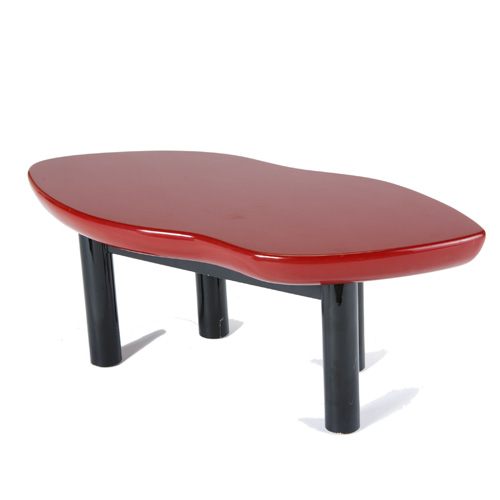 Appraisal: MODERN Lip-shaped coffee table with red and black lacquered finish